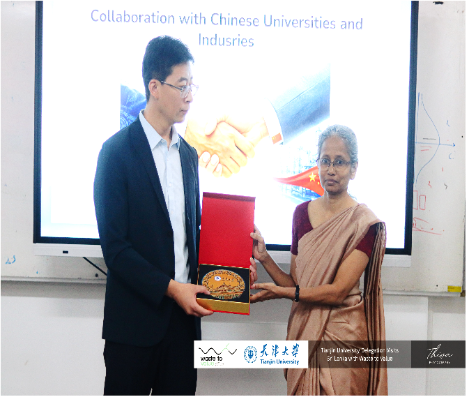 Prof. (Ms.) Manisha Gunasekara, Head/DCPE, receiving a souvenir from a representative of Tianjin University, China, during the visit